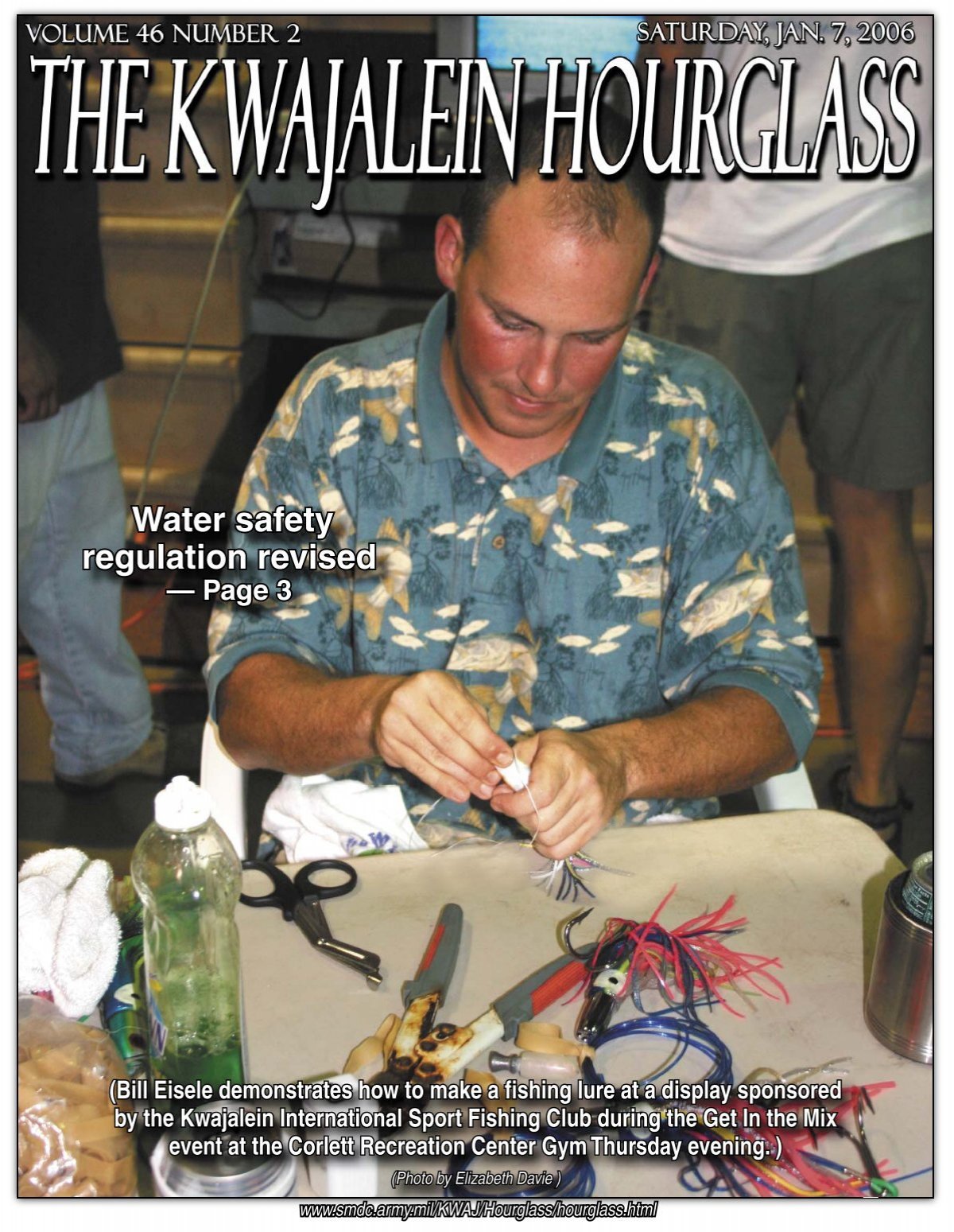 Bill Eisele demonstrates how to make a fishing lure at a display